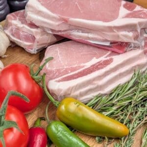 Bacon chops with a selection of herbs and vegetables