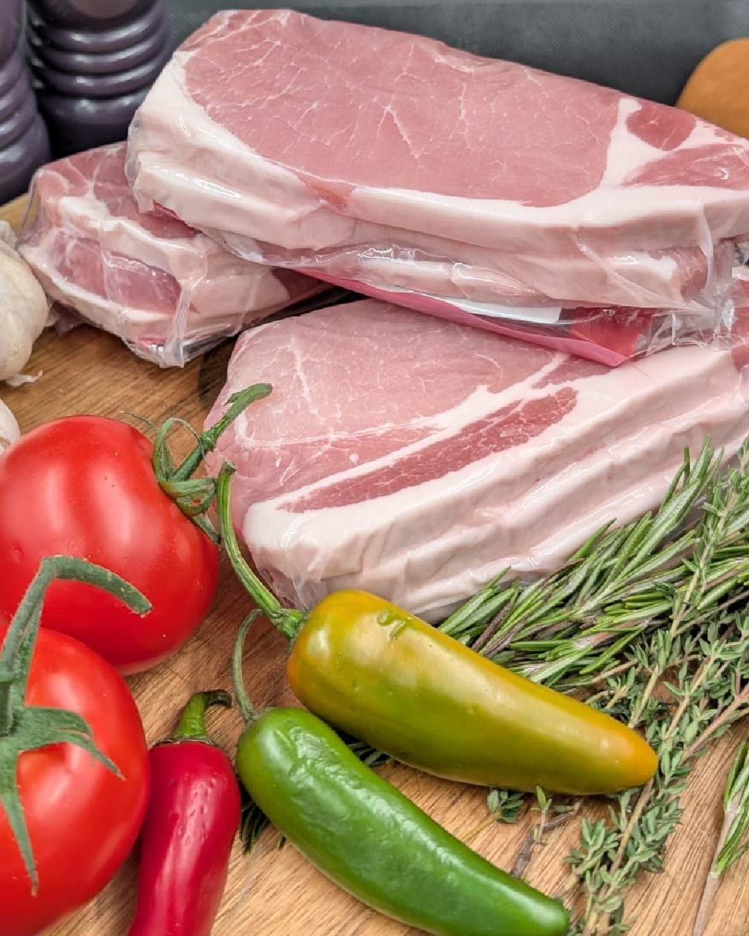 Bacon chops with a selection of herbs and vegetables