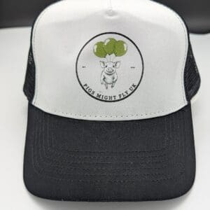 Pigs Might Fly UK black and white trucker cap front view